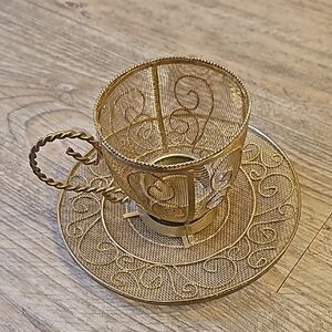 Elegant Gold Filigree Teacup and Saucer Set